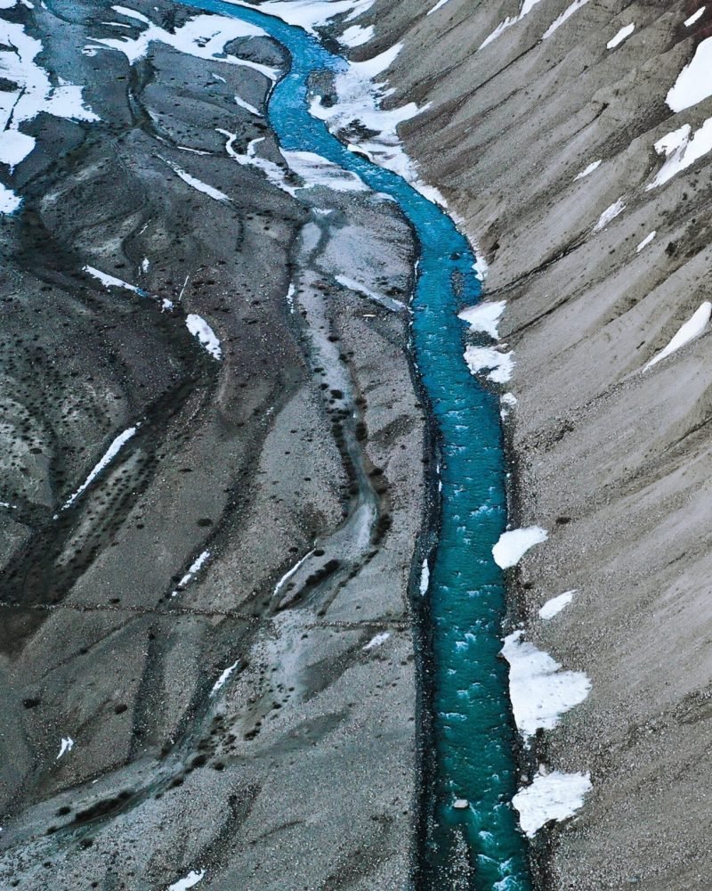 An aerial view of Pin river flowing down the rough terrain of Pin valley National Park